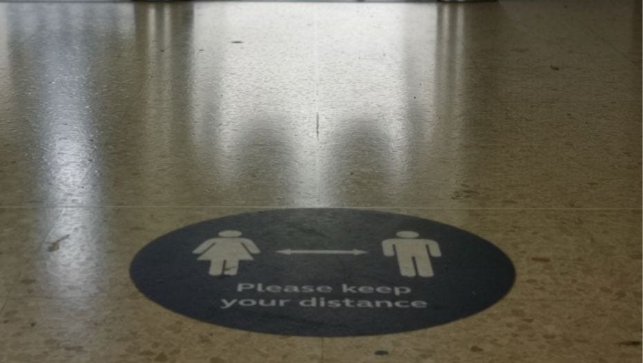 Please keep your distance floor sign