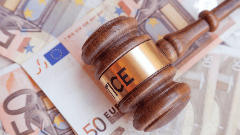 Judge's hammer on top of Euro bank notes