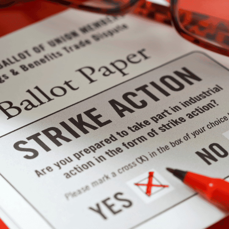 Close up of a strike ballot paper with an x in the yes box.