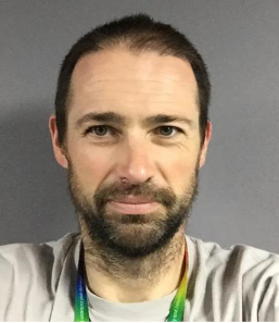 Robert Gardner a white man wearing a rainbow lanyard