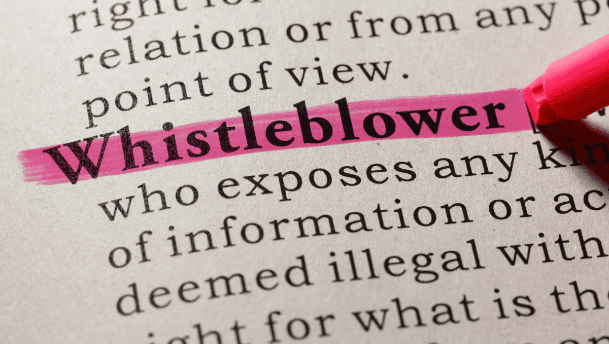 Close up of the word 'Whistleblower' in a dictionary definition