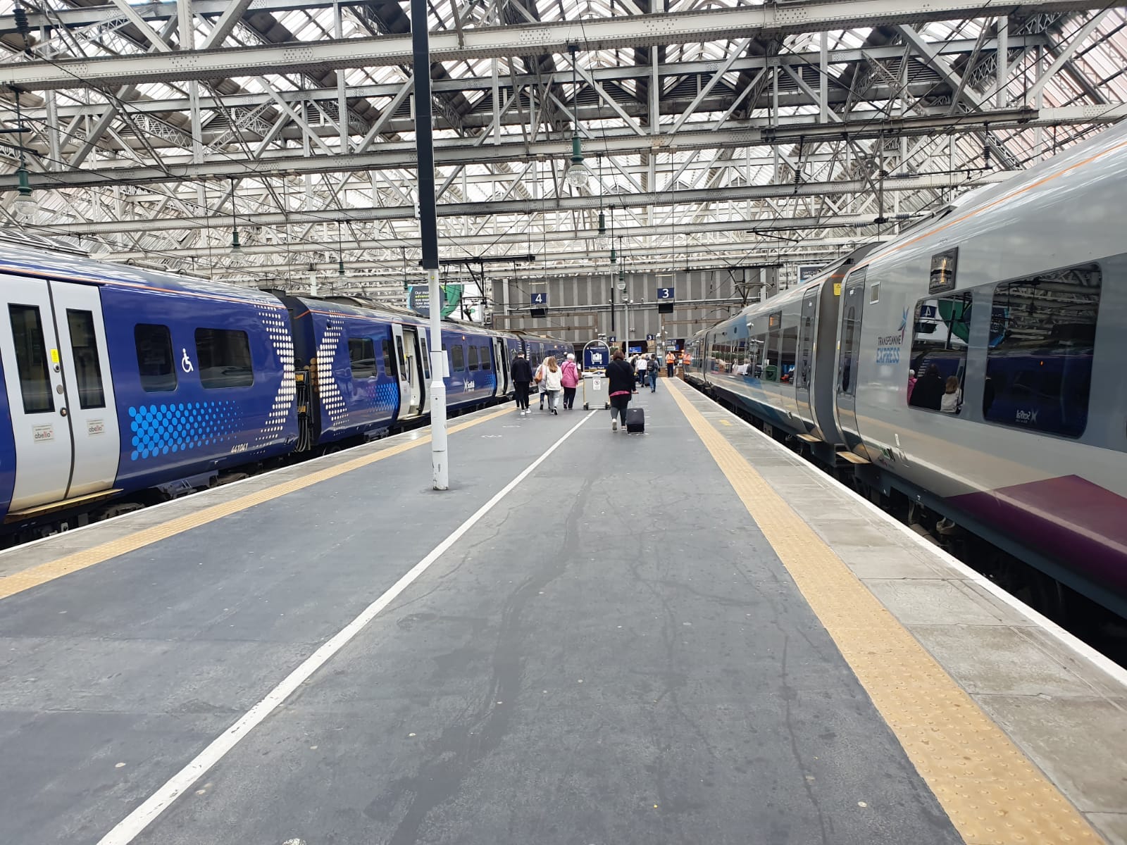 Station platform, ScotRail train on left, Transpennine train on right. Photo by Liz Warren-Corney