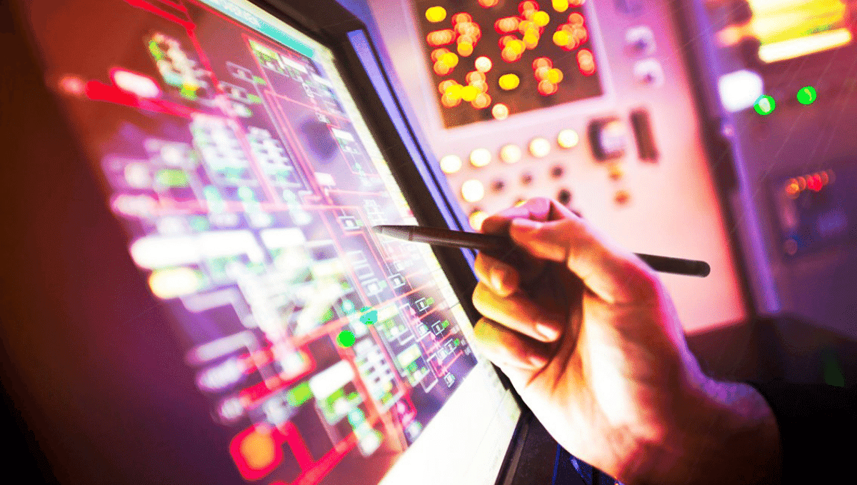 Digital railway control screen with hand and pen in shot