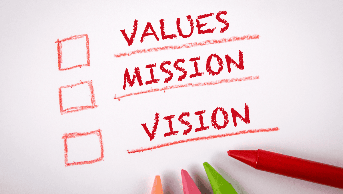 Mission, vision, values written in red crayon