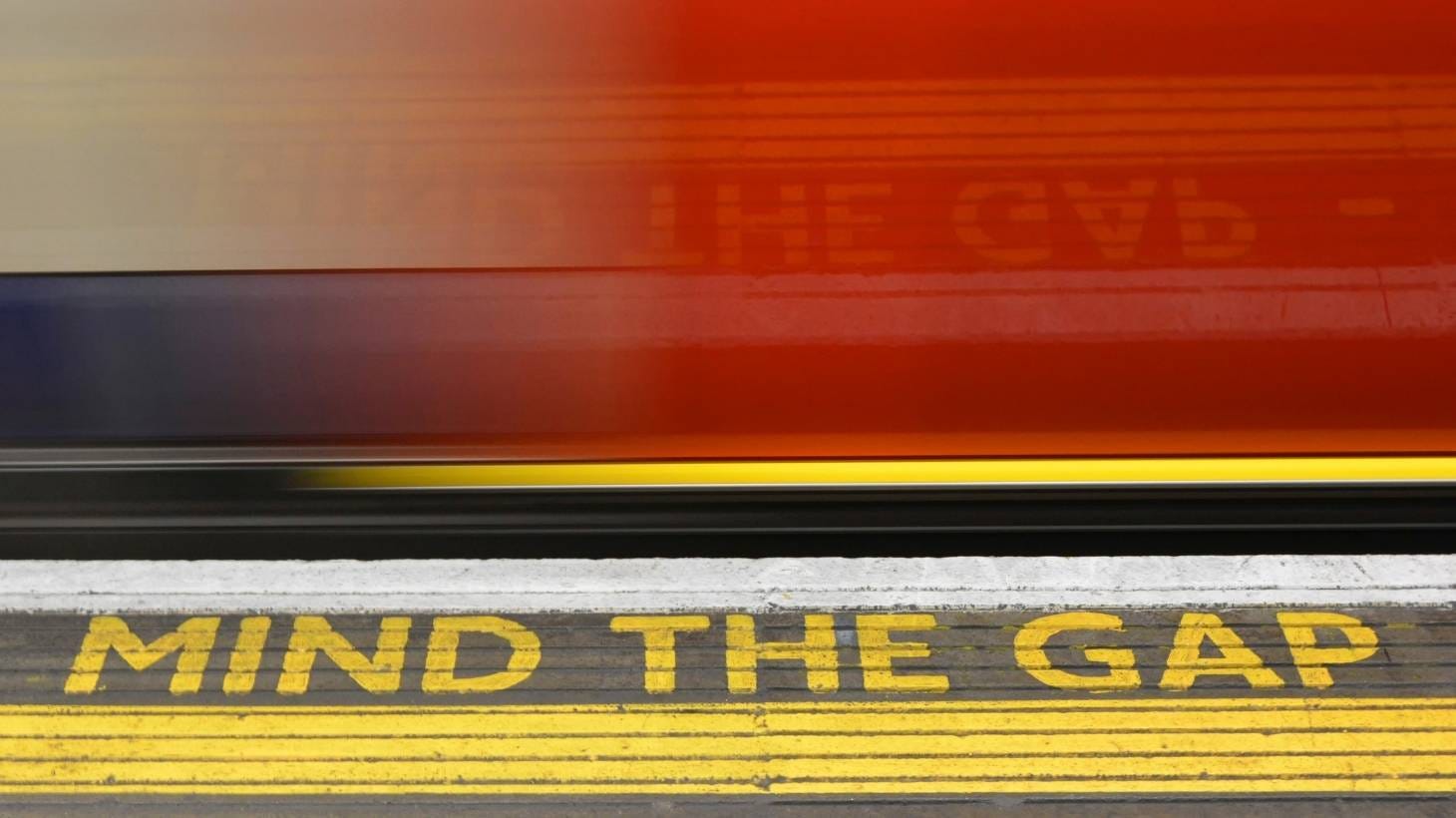 "Mind the gap" writing on platform edge 