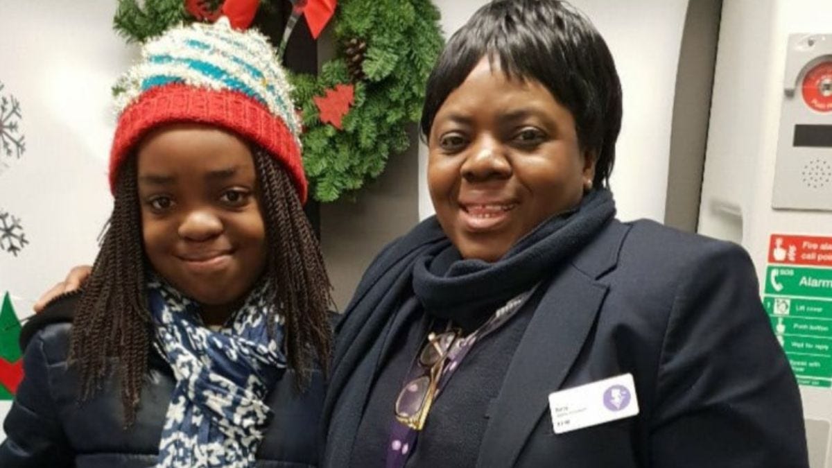 Belly Mujinga in uniform with her young daughter