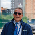 Anthony Moynihan TPE Representative - White man wearing sunglasses and blue coat