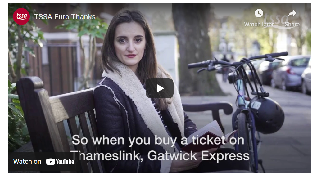 A screenshot from a YouTube video called "TSSA Euro Thanks. A French woman sitting on a bench looks over her shoulder to face the camera. captions read "So when you buy a ticket on Thameslink, Gatwick Express" 