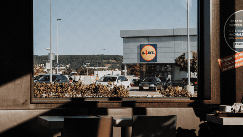 Exterior of a Lidl supermarket with cars parked