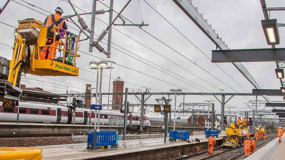 Network Rail engineers in high vis doing overhead wires and improvement works at Leeds station