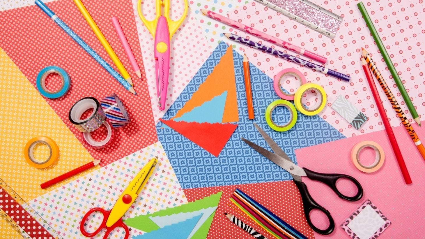 A collection of craft tools such as pens,scissors,tape