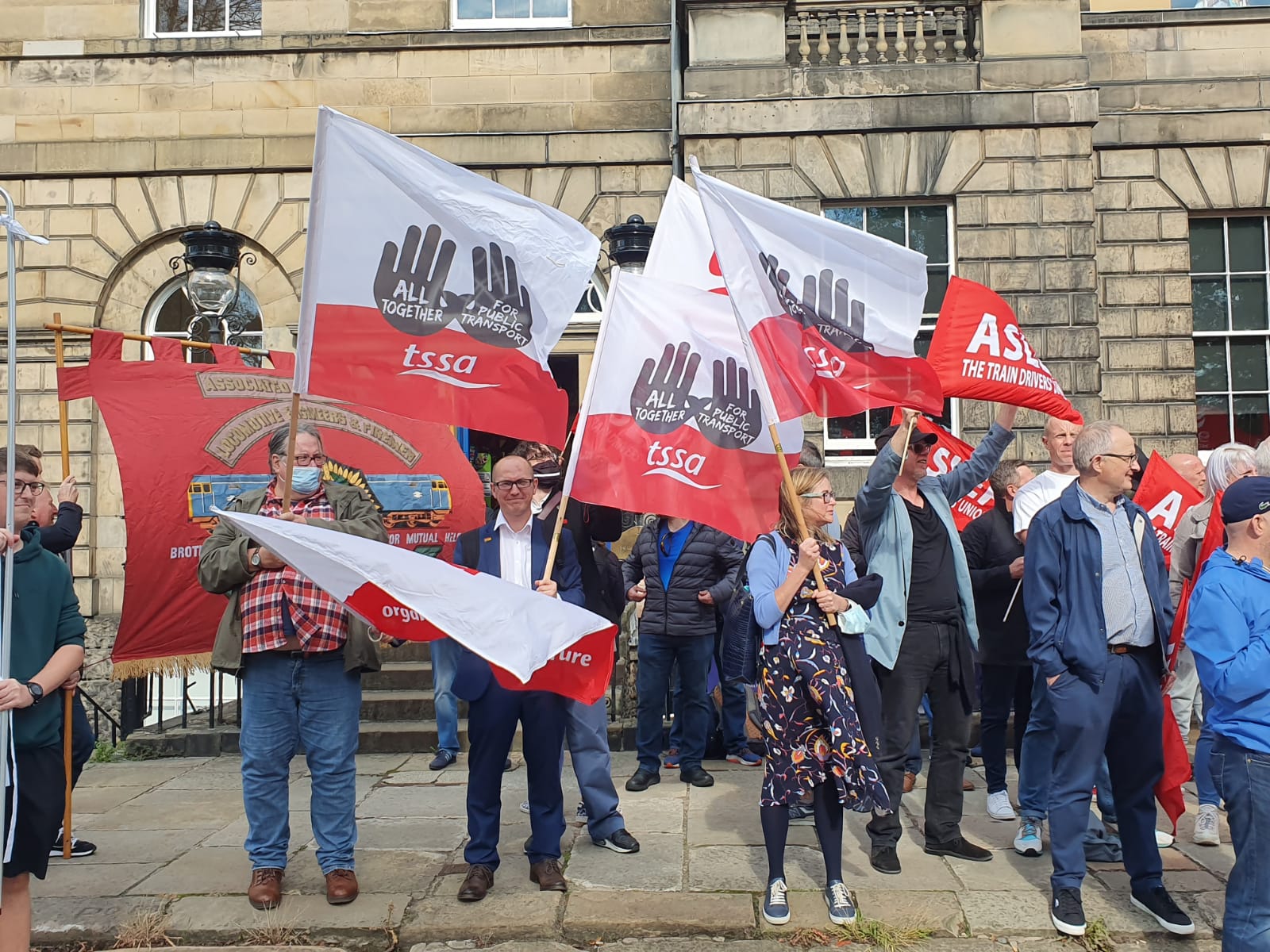Protestors hold TSSA banners at Save our ScotRail demo - credit Liz WC
