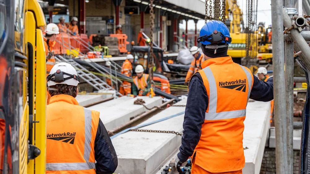 Network Rail engineers in high vis and hard hats at Warrington Bank Quay station