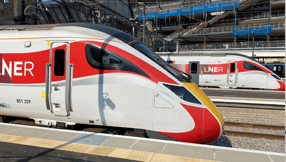 Two LNER trains at platforms in Kings Cross station