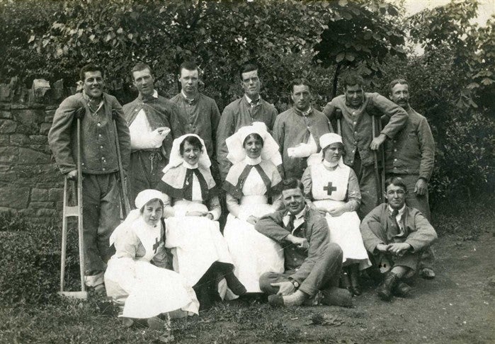 V.A.D. nurses with wounded soldiers in garden, Southmead, Bristol.