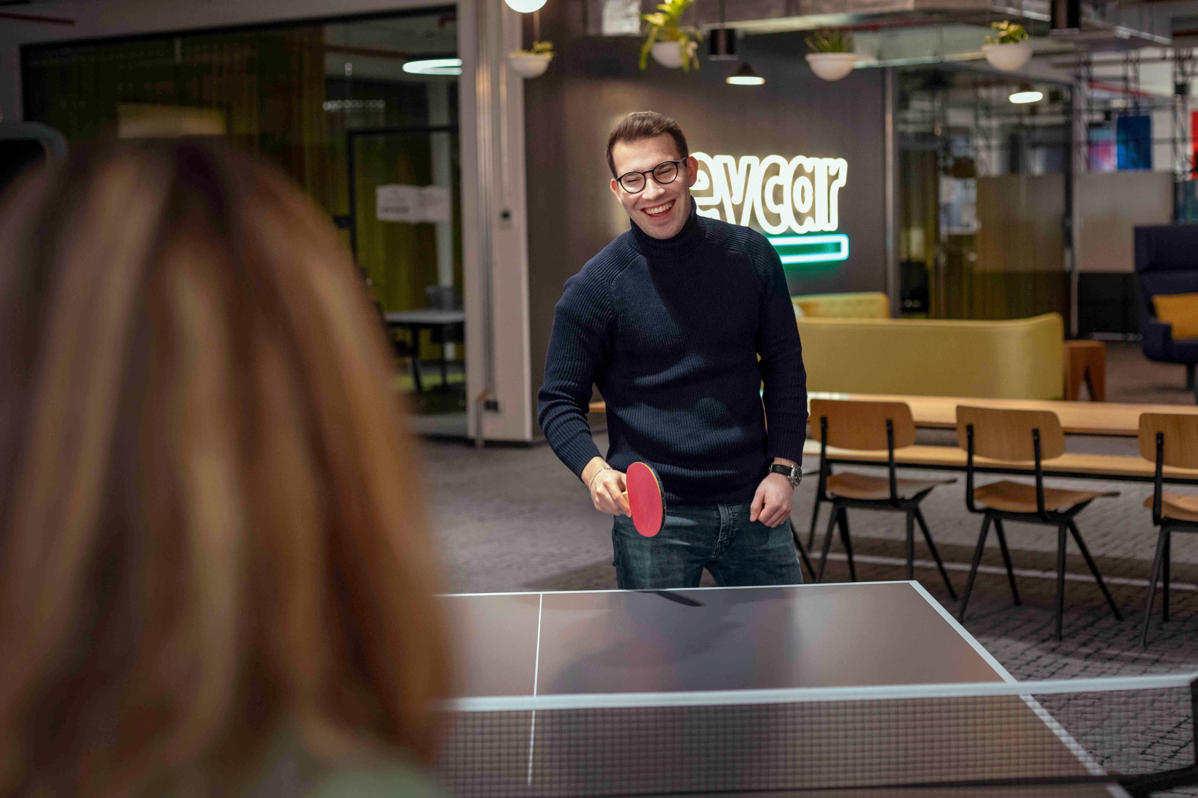 Playing table tennis in the office