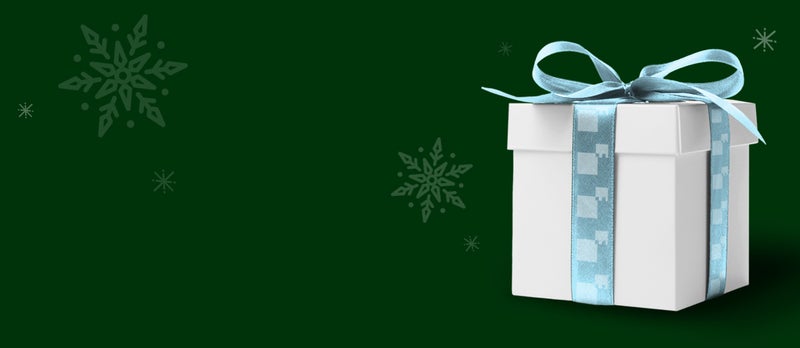 A white present with a blue bow and green festive background