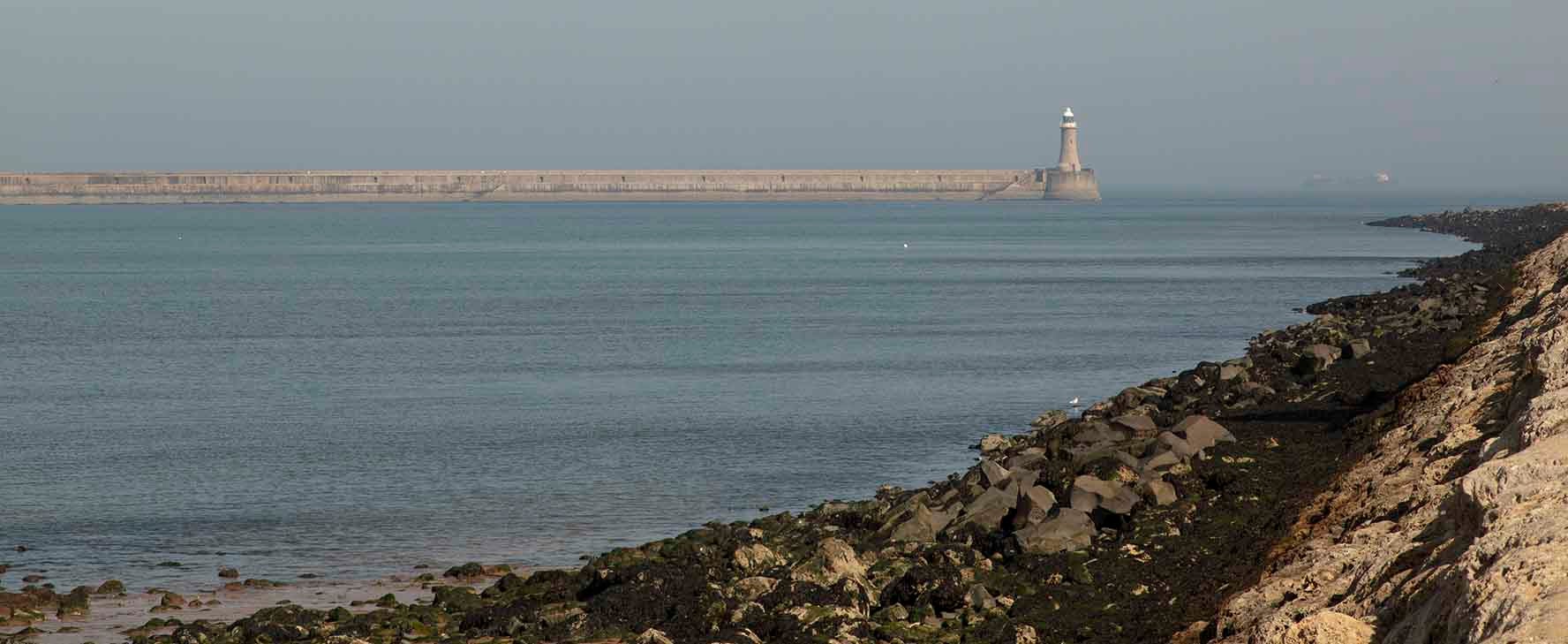 South Shields seascape, with a light house in the distance. 