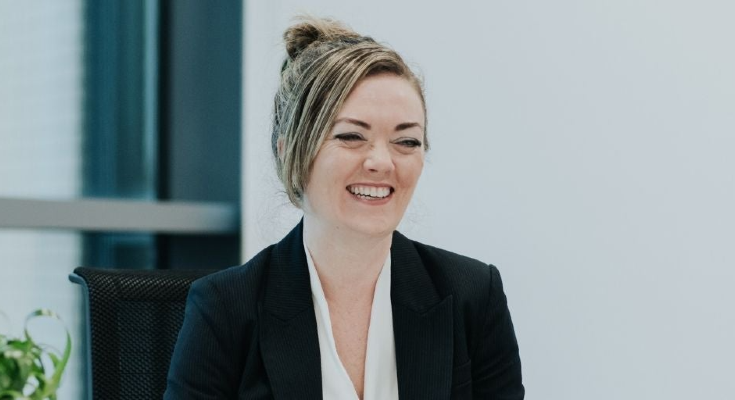 Sara Hollingsworth sat at a desk