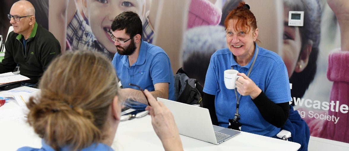 Four people enjoying a cuppa and a chat.