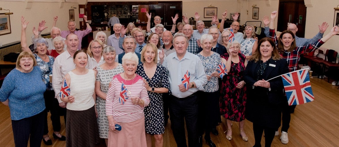 A group of people celebrating the Queen's Jubilee.