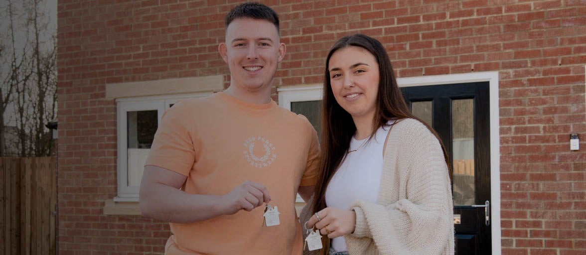 Ben and Rosanna with the keys to their new home.