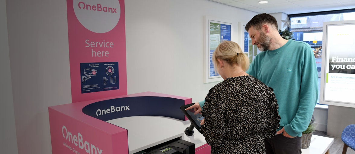 Man and woman using the OneBanx kiosk in the Gosforth branch
