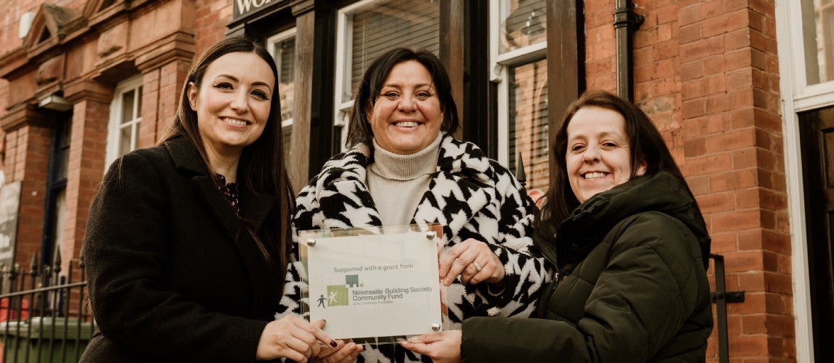 Jennie Pitt, Head of Diversity, Equality and Inclusion at Newcastle Building Society Group stood with Andrea Bulmer and Jayne Simpson of Sunderland Women's Centre, holding a commemorative plaque.