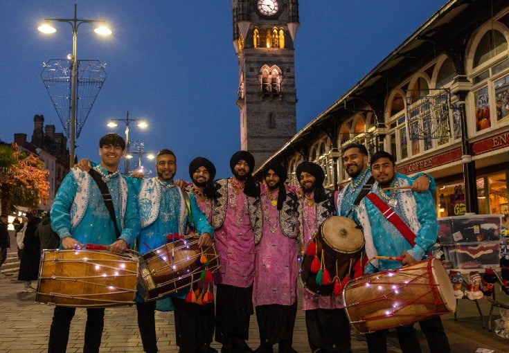A group of men holding drums during the Darlington Diwali parade.