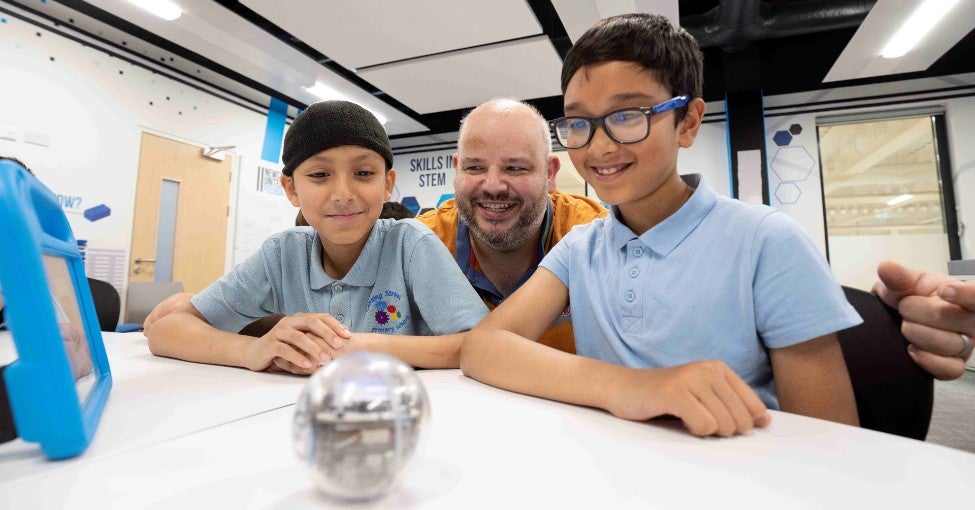 One of our IT colleagues volunteering at a Newcastle United Foundation STEM session for schoolchildren. 