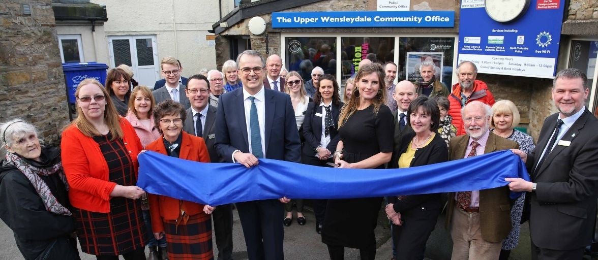 A crowd including Newcastle Building Society CEO, Andrew Haigh, celebrate the opening of our branch in Hawes