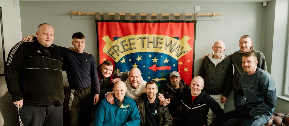 A group of men posing for the camera.