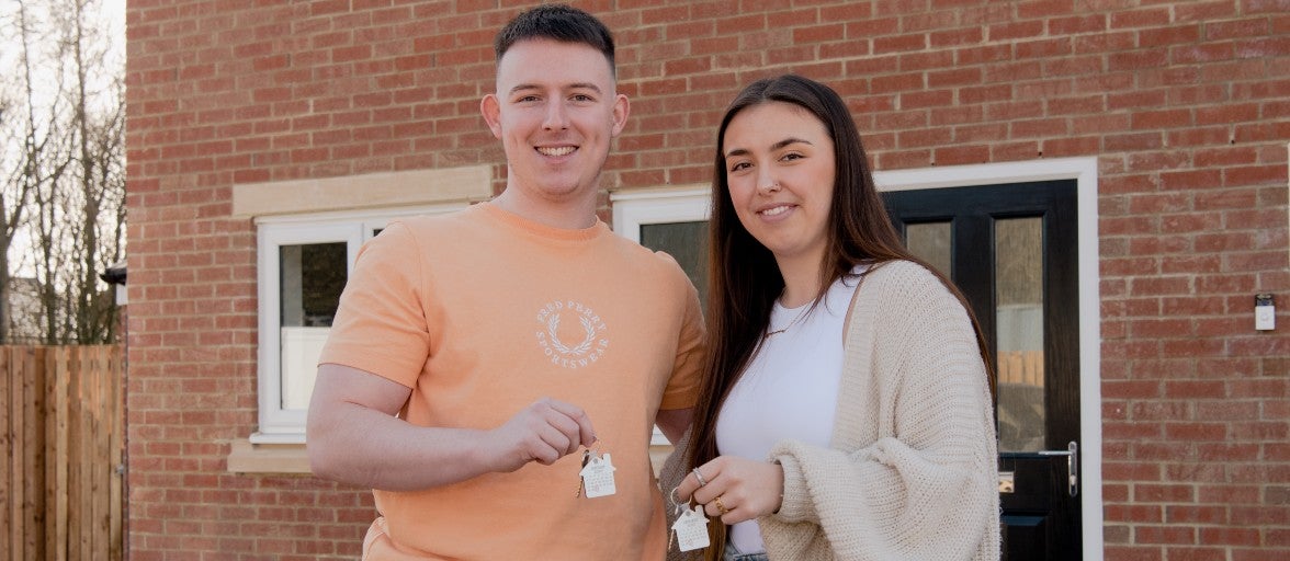 Ben and Rosanna with the keys to their new home.