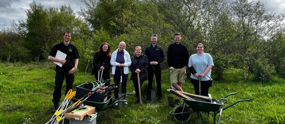 Members of our Product & Commercial department volunteering at Pegswood Community Park.