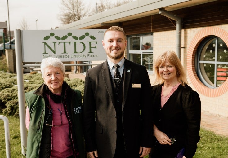 Two members of North Tyneside Disability Forum stood outside of their centre, with our North Shields Branch Manager, Jonathan Fincken.