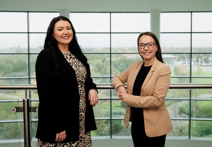 Two of our colleagues from Newcastle Financial Advisers inside our Head Office at Cobalt Business Park. On the left is Beth Hunter, Paraplanning Team Leader, and on the right is Beth Muir, Operations Team Leader.