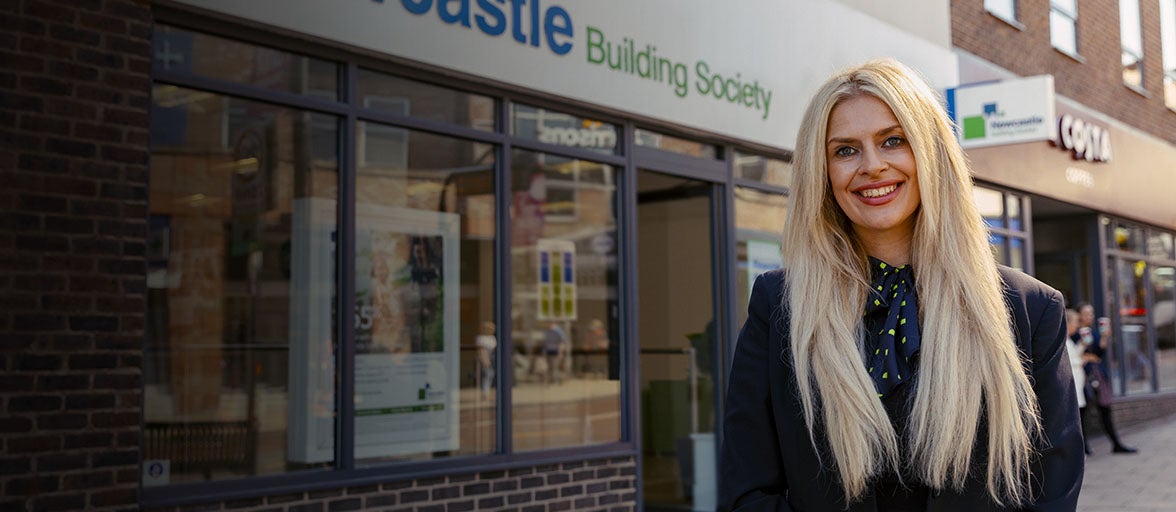 Sarah Covil, Branch Manager of Chester-le-Street, stood outside of the branch smiling. 