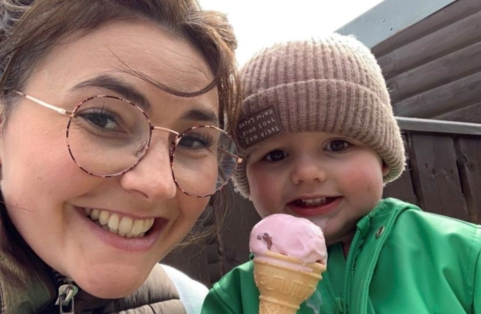 A colleague and her son with an ice cream
