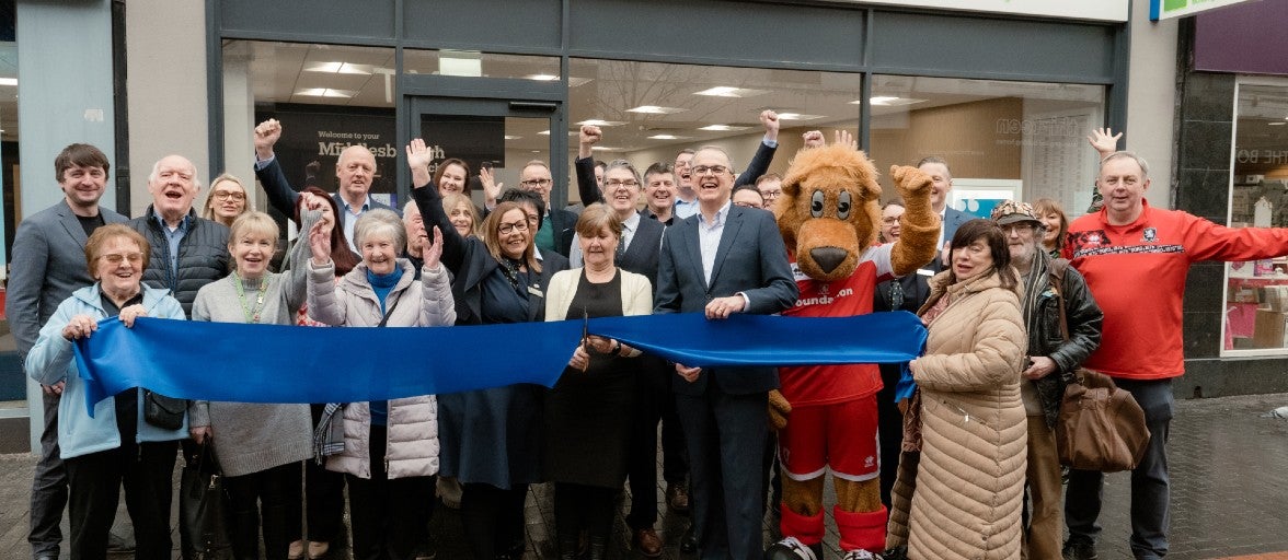 A group of Newcastle Building Society colleagues and local Pickering representatives getting ready for the ribbon cutting outside of the new Pickering branch.