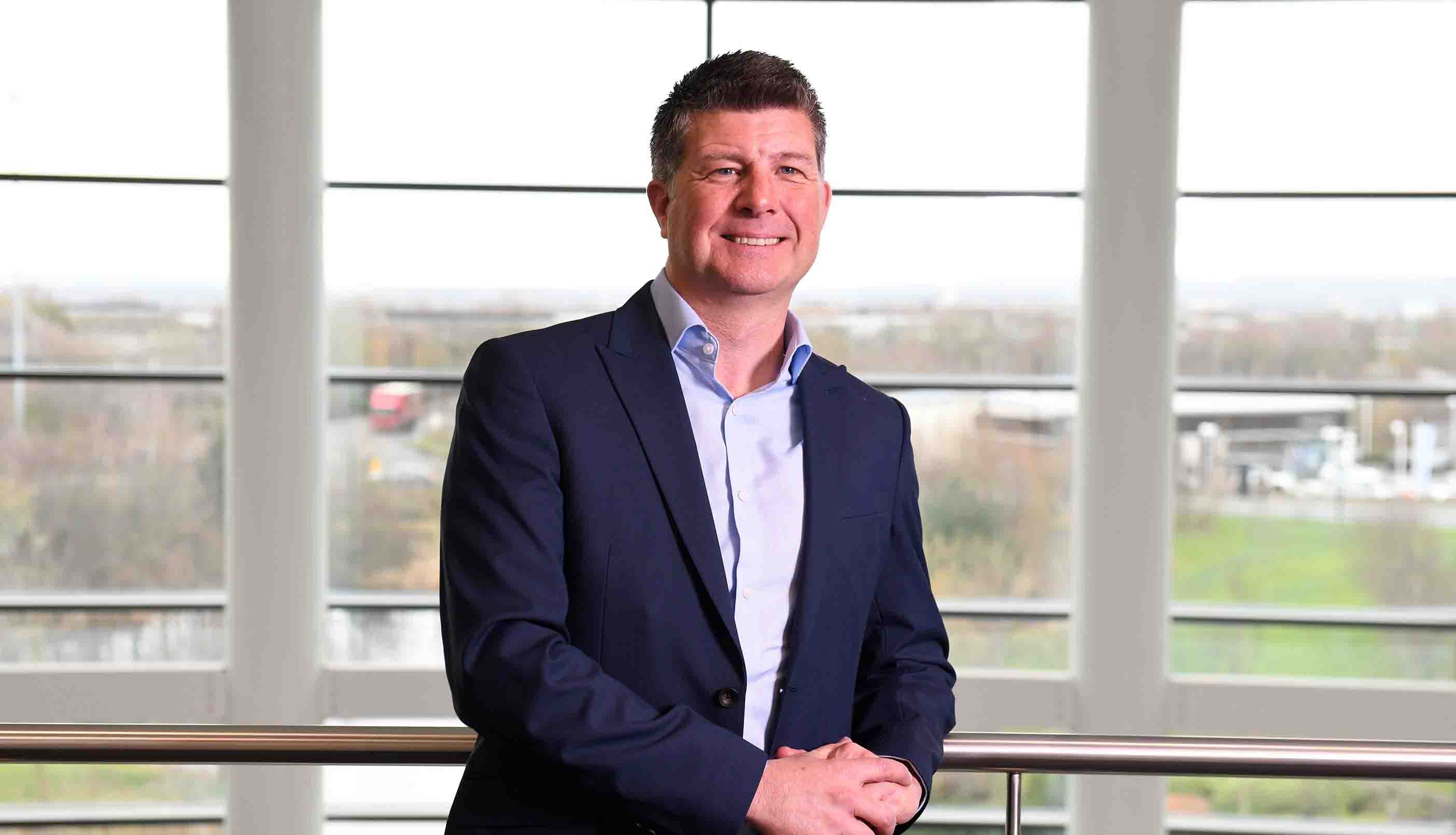 Executive member, Karl Elliott, stood in Newcastle Building Societies head office.