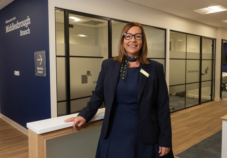 Our Middlesbrough Branch Manager, Kelly, stood smiling inside the branch.