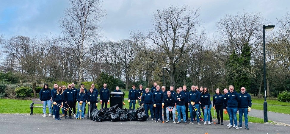 IT colleagues volunteering at a park in Newcastle to do some litter picking.