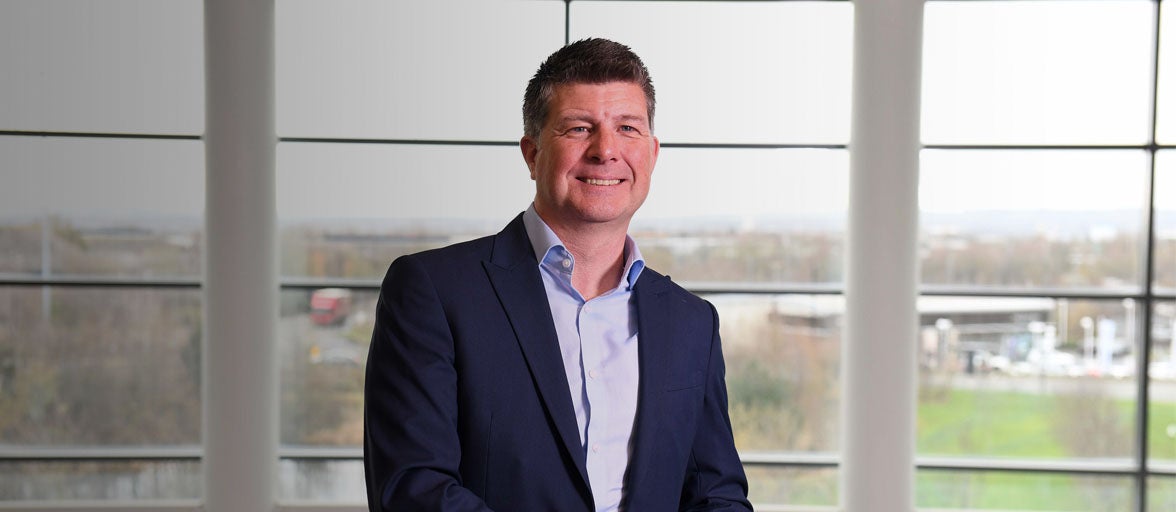 Executive member, Karl Elliott, stood in Newcastle Building Societies head office.  