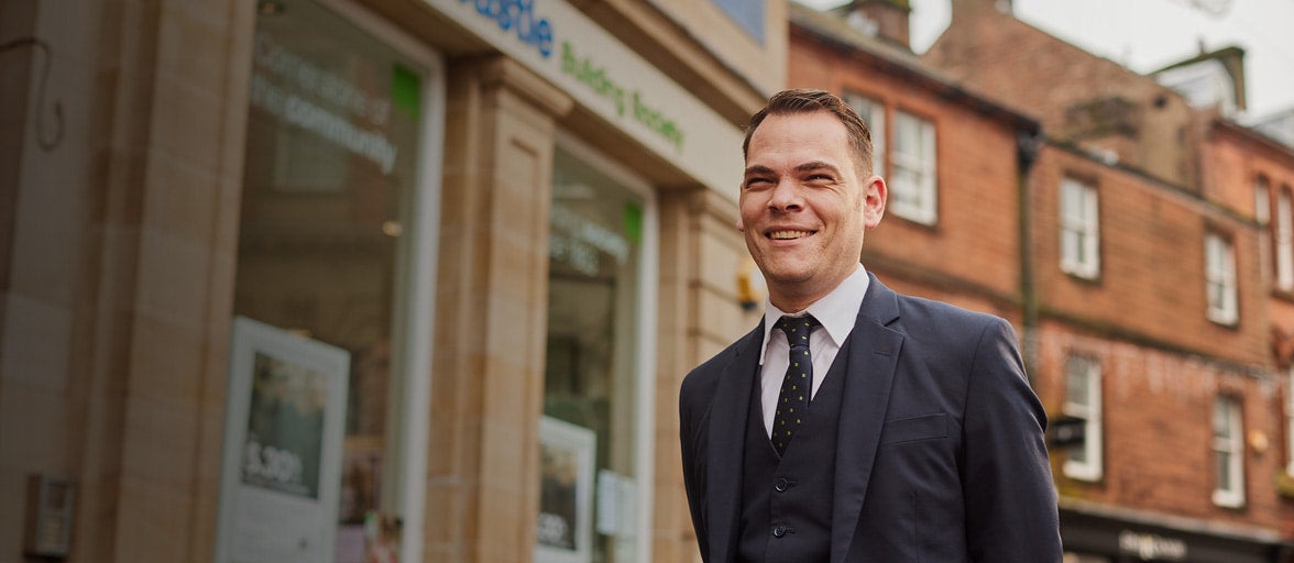 Penrith Branch Manager, James, stood outside of the branch smiling. 