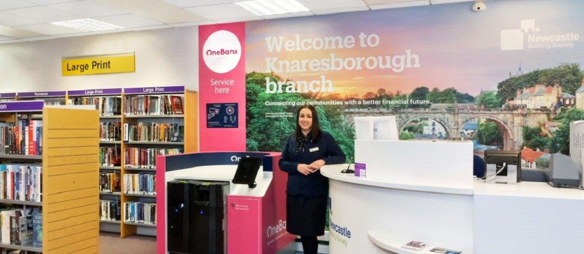 Knaresborough Branch Manager, Heather Pearman, stood next to the OneBanx kiosk inside the Knaresborough Library Branch