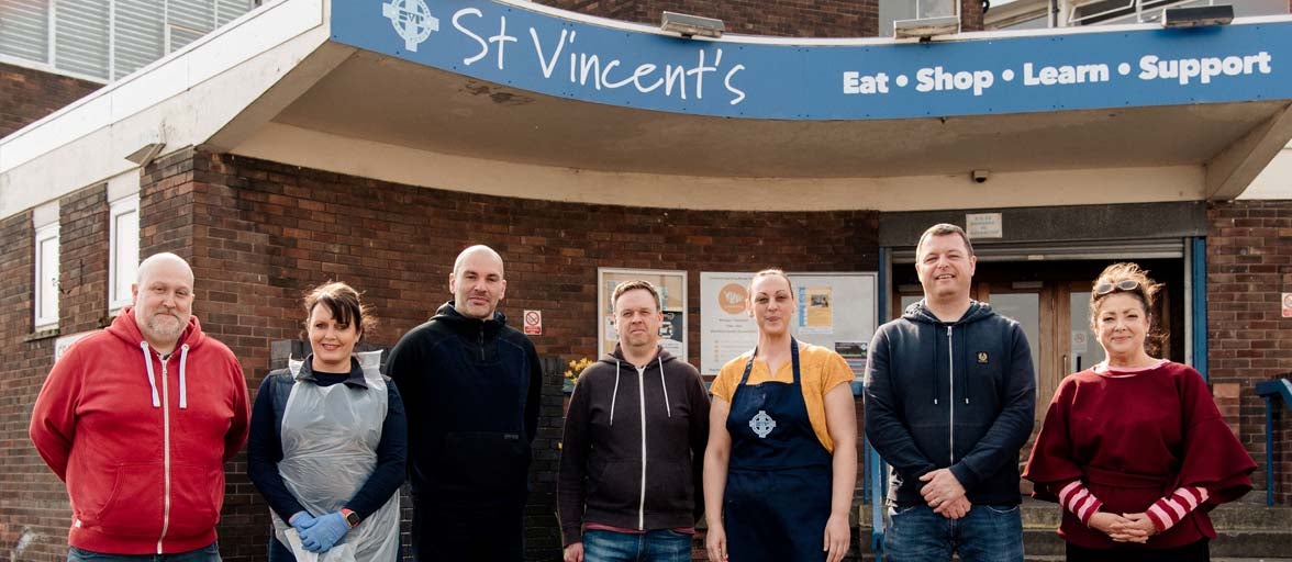 Volunteers standing in front of St Vincent's 