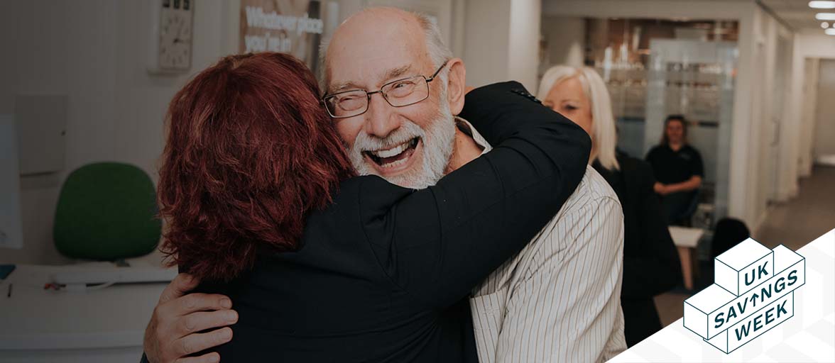 A man and woman hugging in a branch 