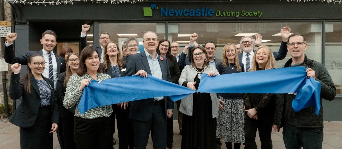 A group of Newcastle Building Society colleagues and local Pickering representatives getting ready for the ribbon cutting outside of the new Pickering branch.