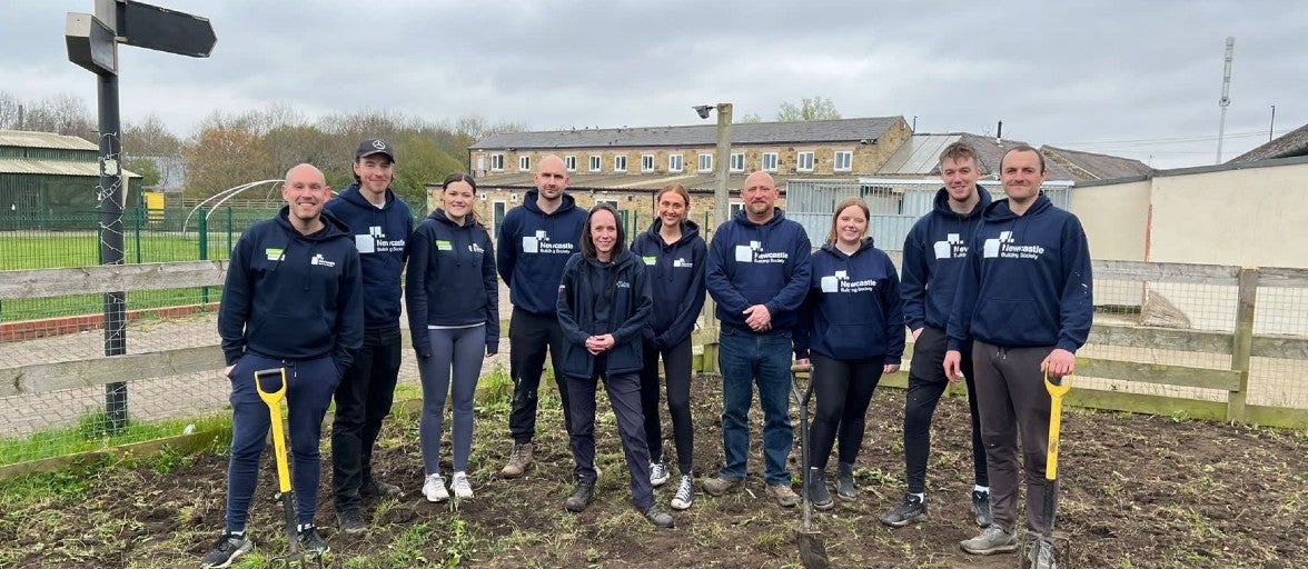 IT colleagues volunteering at Newcastle Dog & Cat Shelter to do some gardening. 