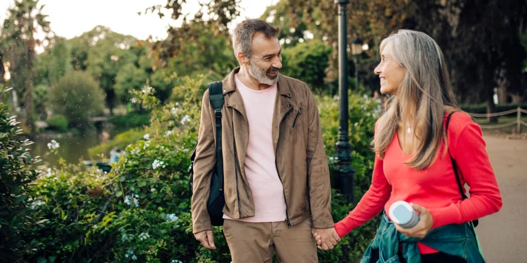 Couple holding hands walking